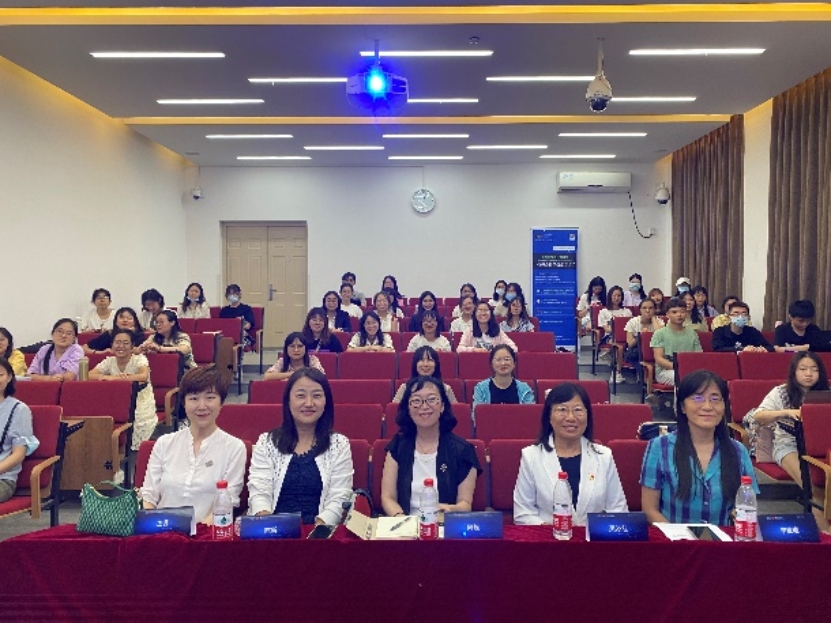 A group of people sitting at a table

Description automatically generated with low confidence